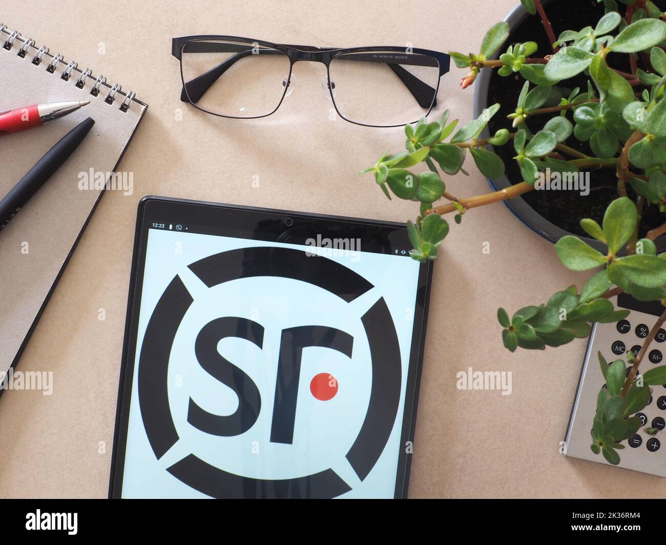 In this photo illustration, SF Holding Company Limited logo seen displayed on a tablet. Stock Photo