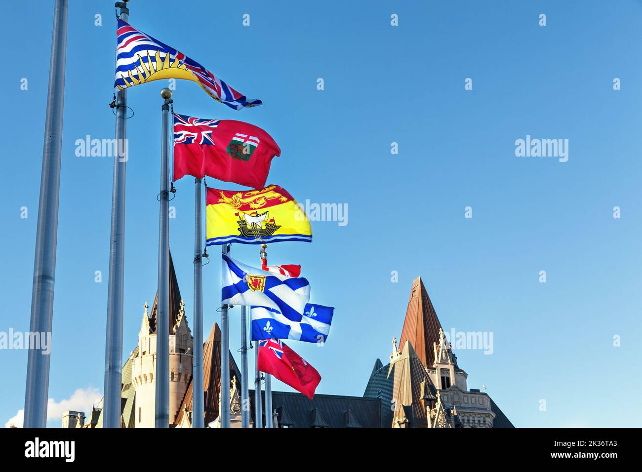 Provincial flags of Canada on Parliament Hill  in Ottawa, Ontario. From front to back the flags represent British Columbia, Manitoba, New Brusnwick, N Stock Photo