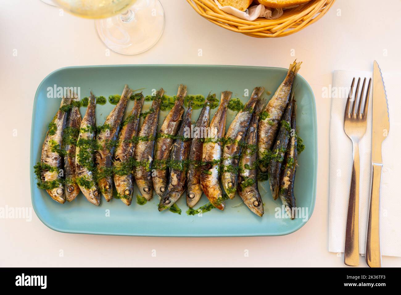 Grilled sardines with gremolata sauce on platter Stock Photo Alamy