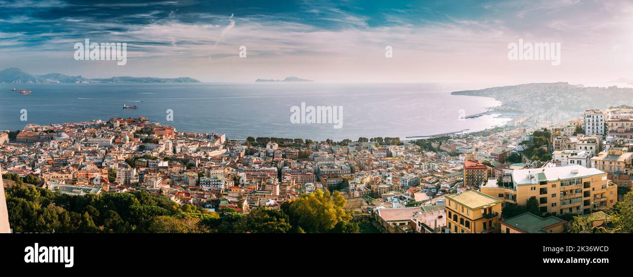 Naples, Italy. Top View Cityscape Skyline With Famous Landmarks And Part Of Gulf Of Naples In Sunny Day. Many Old Churches And Temples Stock Photo