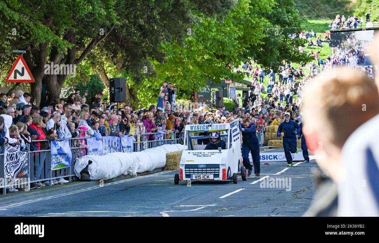 Eastbourne UK 25th September 2022 - Crowds watch competitors take part in the Eastbourne Seafront Soapbox Race held on the seafront on a beautiful warm sunny day : Credit Simon Dack / Alamy Live News Stock Photo