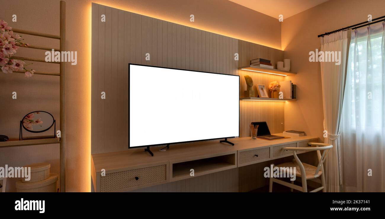 Smart television with white background on tv cabinet. Stock Photo