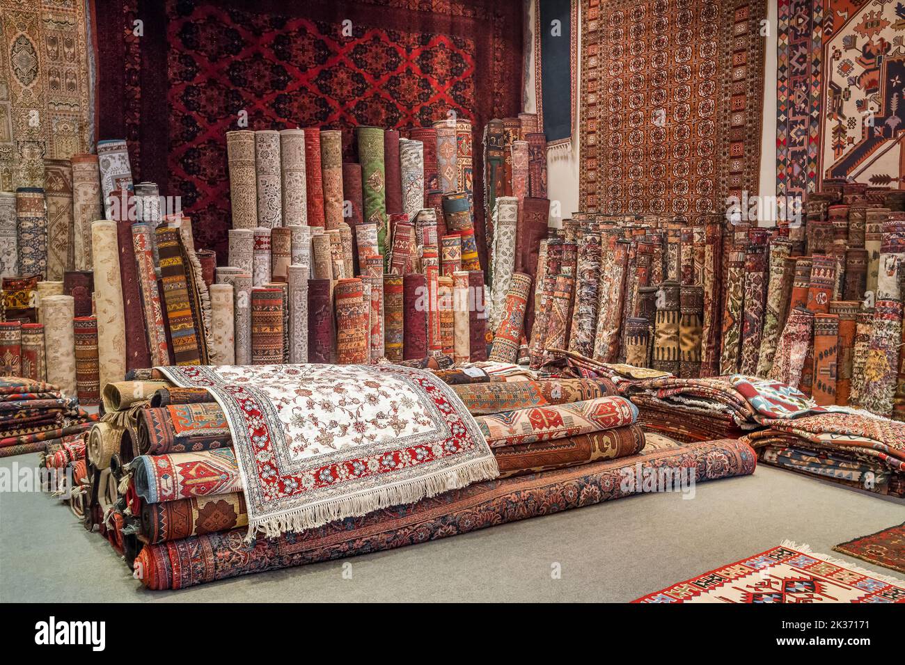 Variety of the gorgeous oriental carpets in traditional carpet store in Middle East Stock Photo