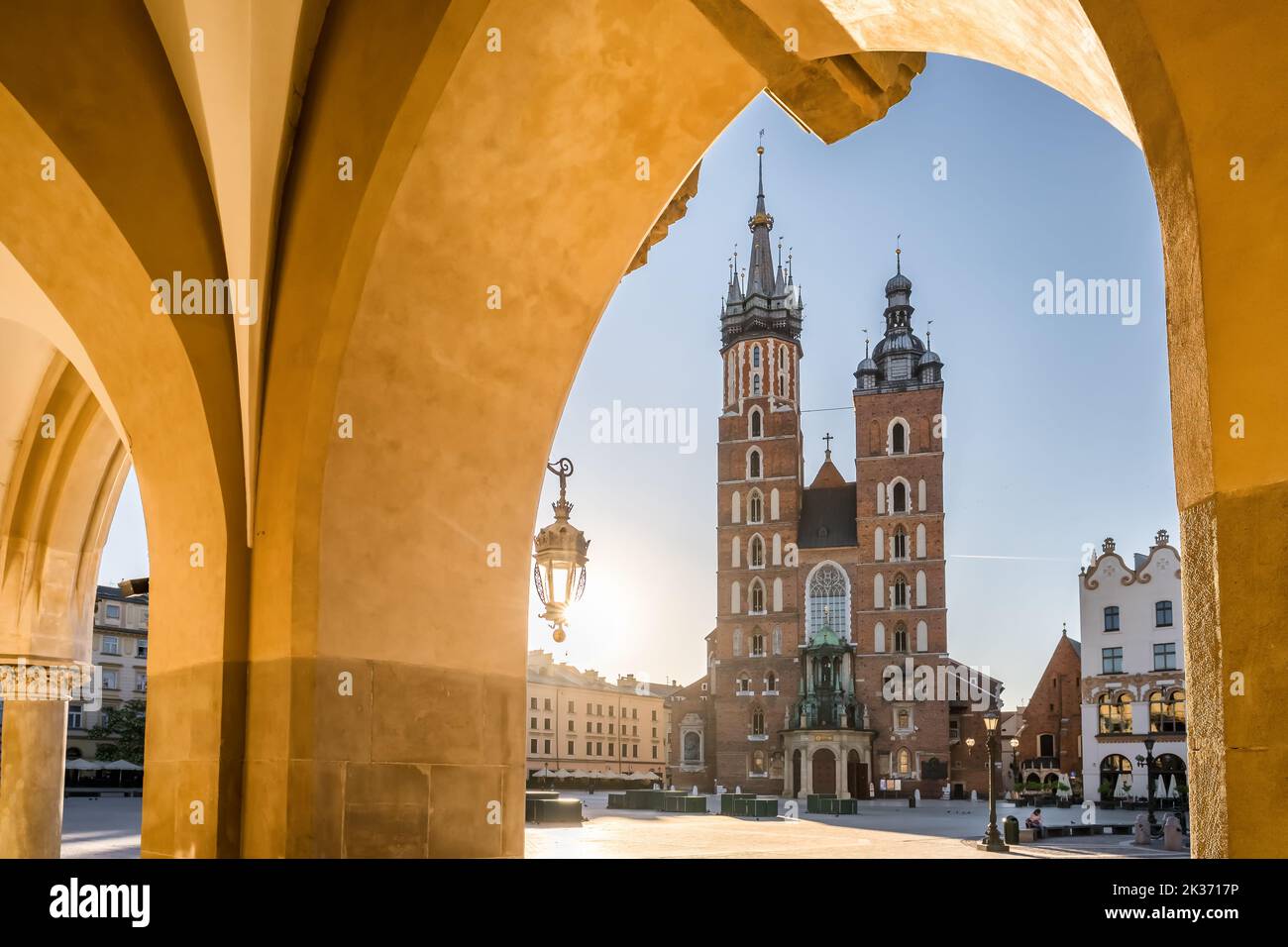 Krakow cloth hall and Saint Mary's Basilica on the main market square at sunrise in Cracow, Poland. Stock Photo