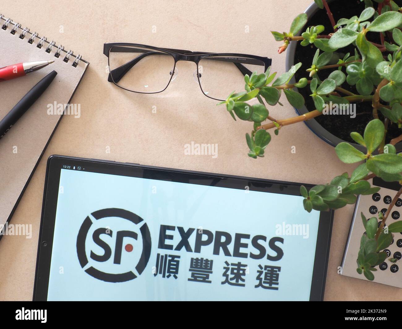 In this photo illustration, SF Express logo seen displayed on a tablet. (Photo by Igor Golovniov / SOPA Images/Sipa USA) Stock Photo