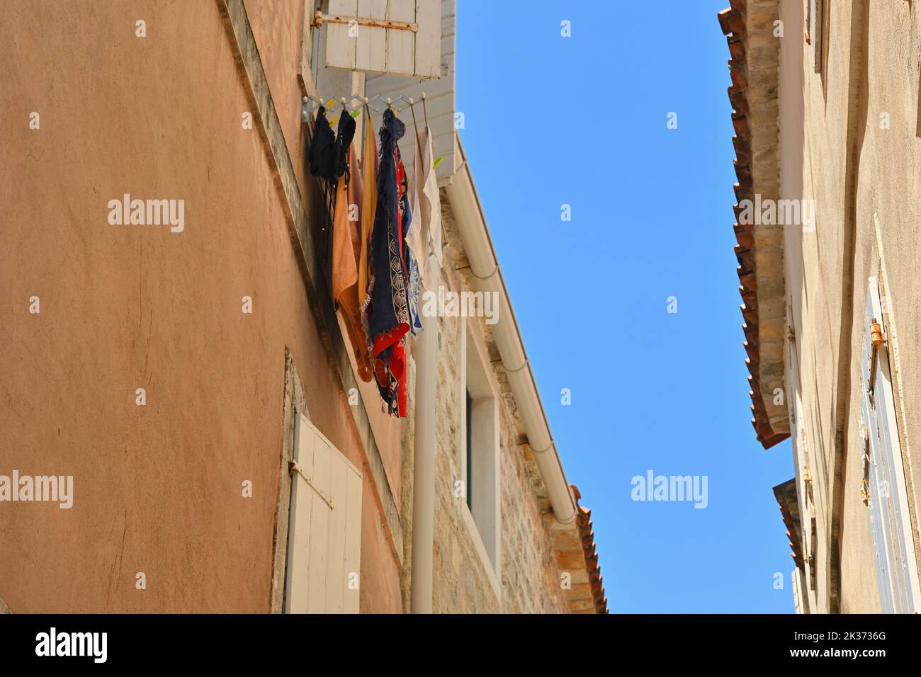 Drying clothes. Architecture of the Old Town in Budva. Montenegro Stock Photo