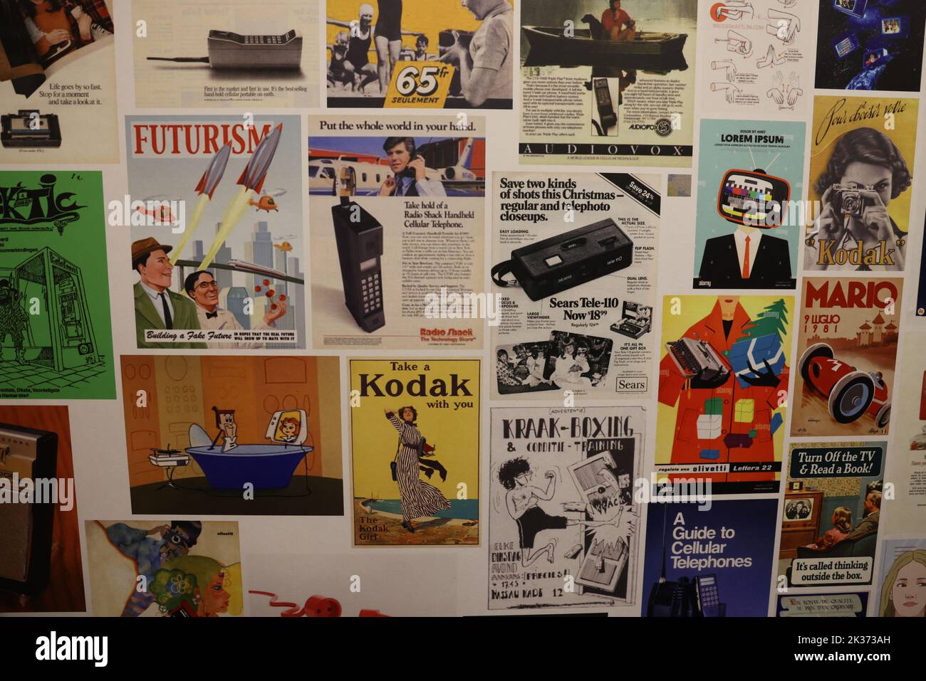 Wall with collection historic advertisements of technological companies and applications, exhibited at the Retrofuture expo in the Evoluon Stock Photo