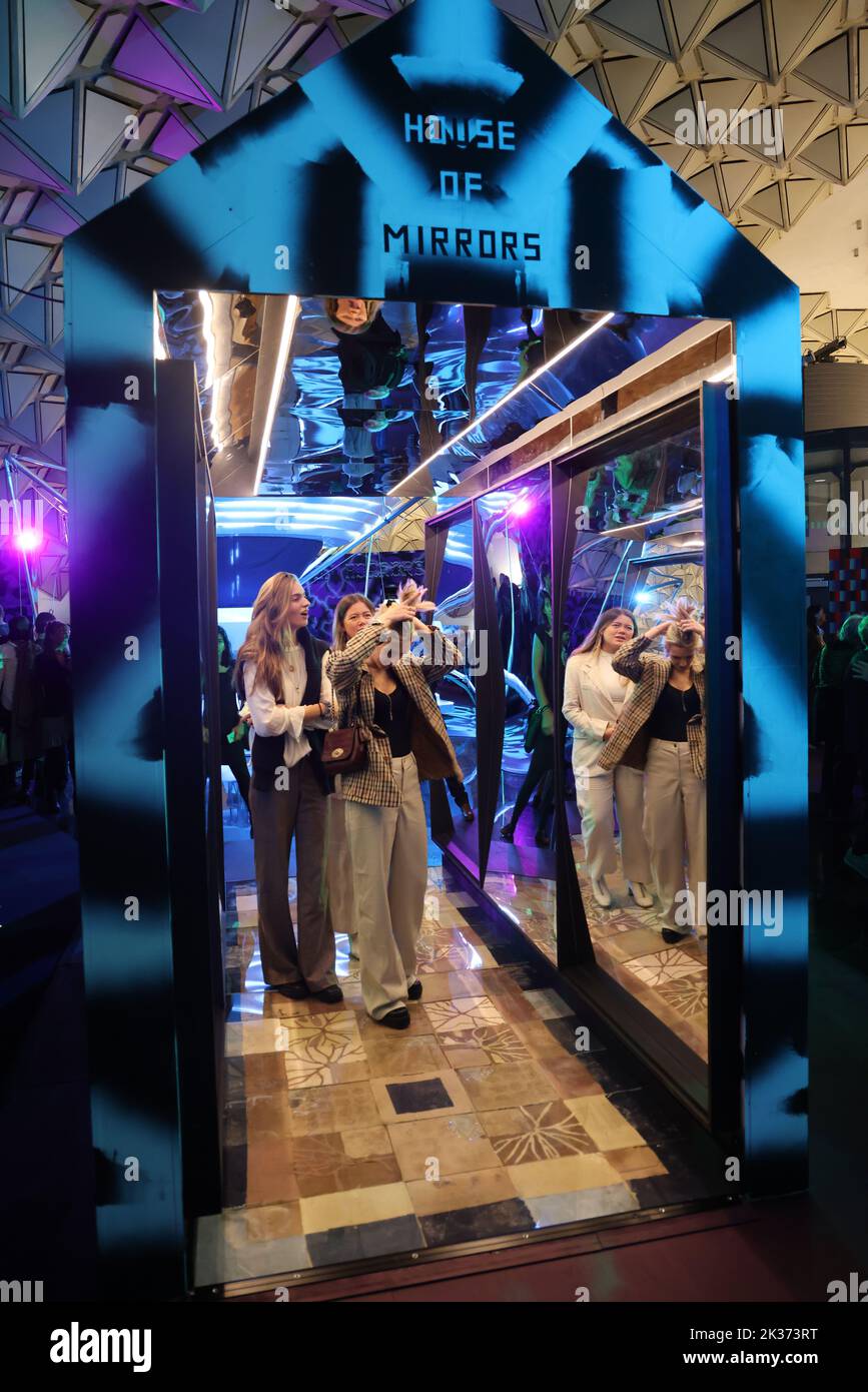 Female visitors in the House of Mirrors, exhibited at the Retrofuture