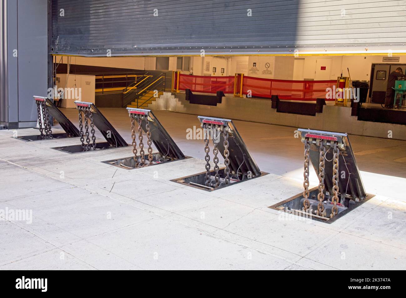 New York, NY, USA - Sept 24, 2022: A series of electronically controlled barricades prevent unauthorized entry into a building loading dock Stock Photo