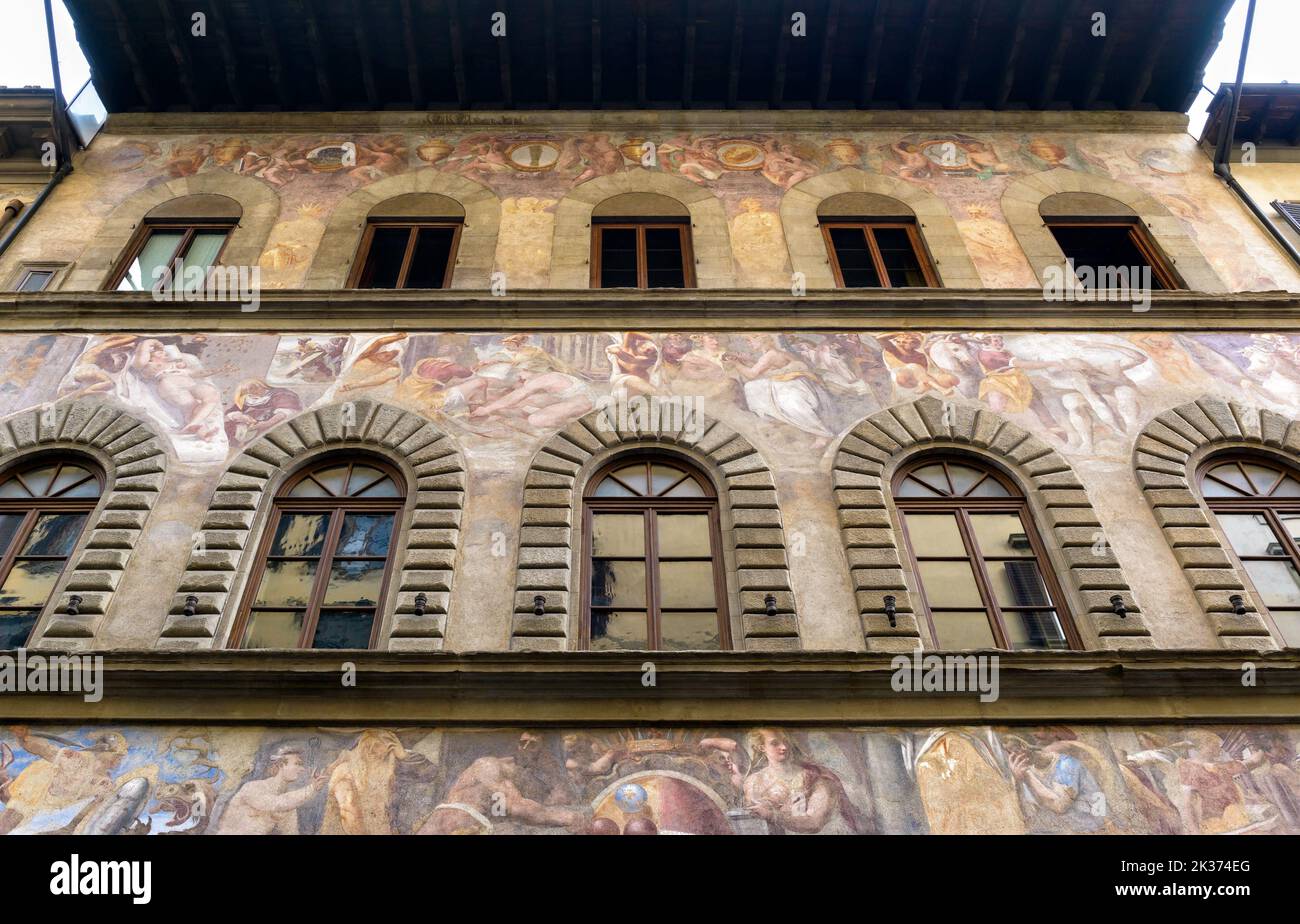 Old painting on building exterior, historic fresco outdoor, Florence, Italy. Painted facade of Renaissance house wall outside. Theme of Italian art, c Stock Photo