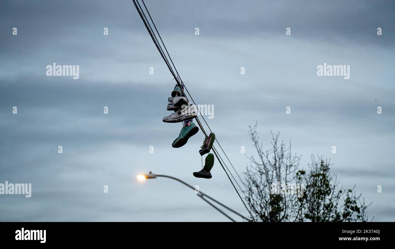 The shoes hanging from the power lines Stock Photo Alamy