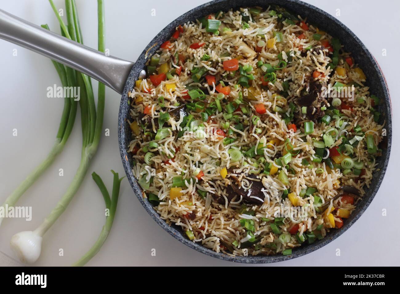 Meat rice vegetables in a pan. Cooked basmati rice tossed with sauteed