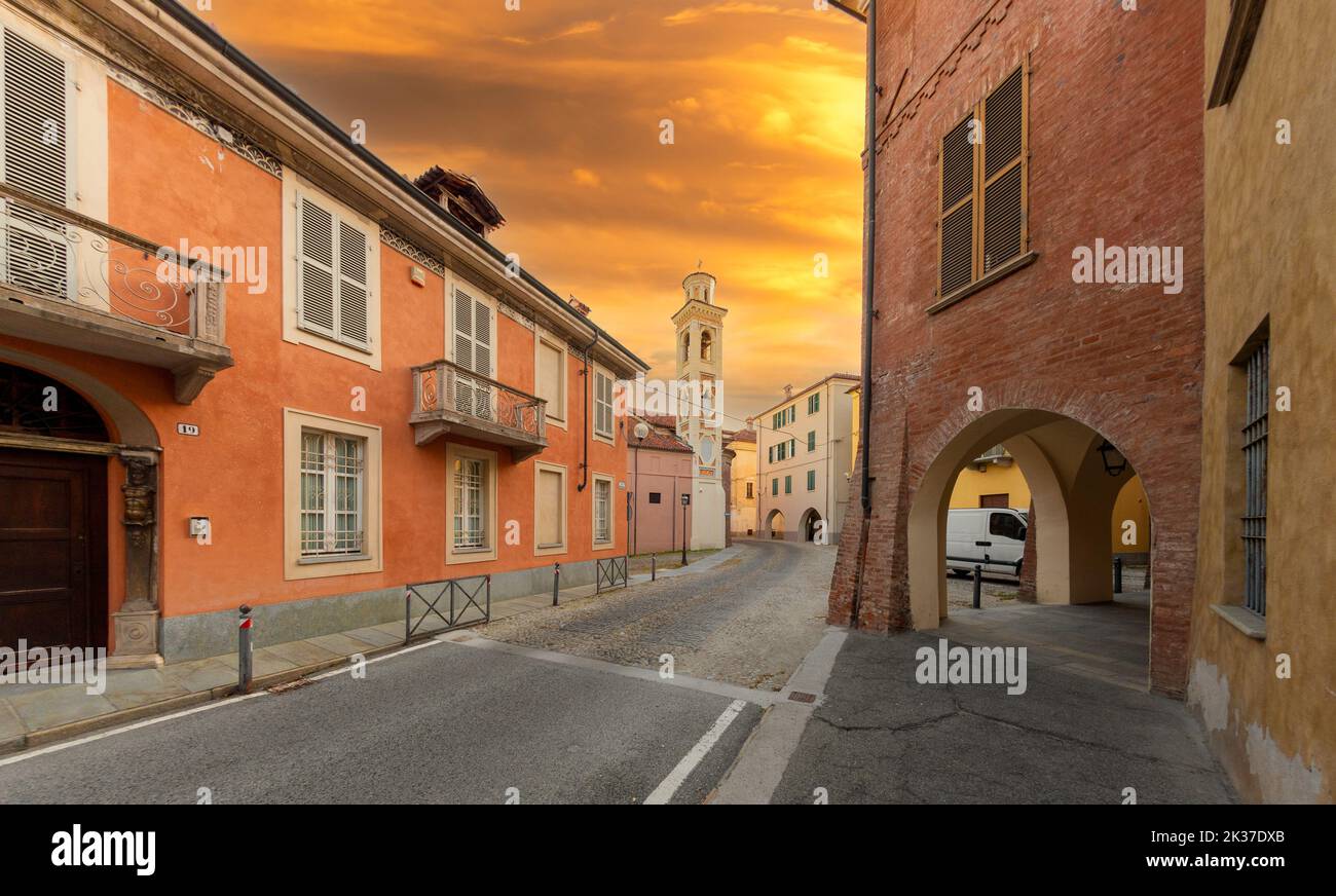 Fossano, Italy - September 23, 2022: Via Garibaldi with the colorful bell tower of the church of San Giorgio in the Borgo Vecchio district (old town) Stock Photo