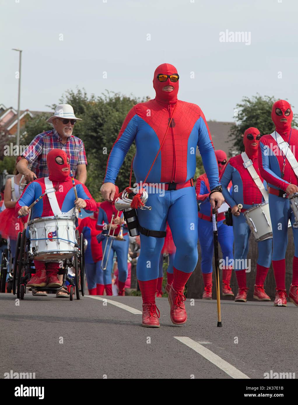 Bournemouth Carnival Band Dressed As Spiderman Marching During The Christchurch Festival, Christchurch UK Stock Photo