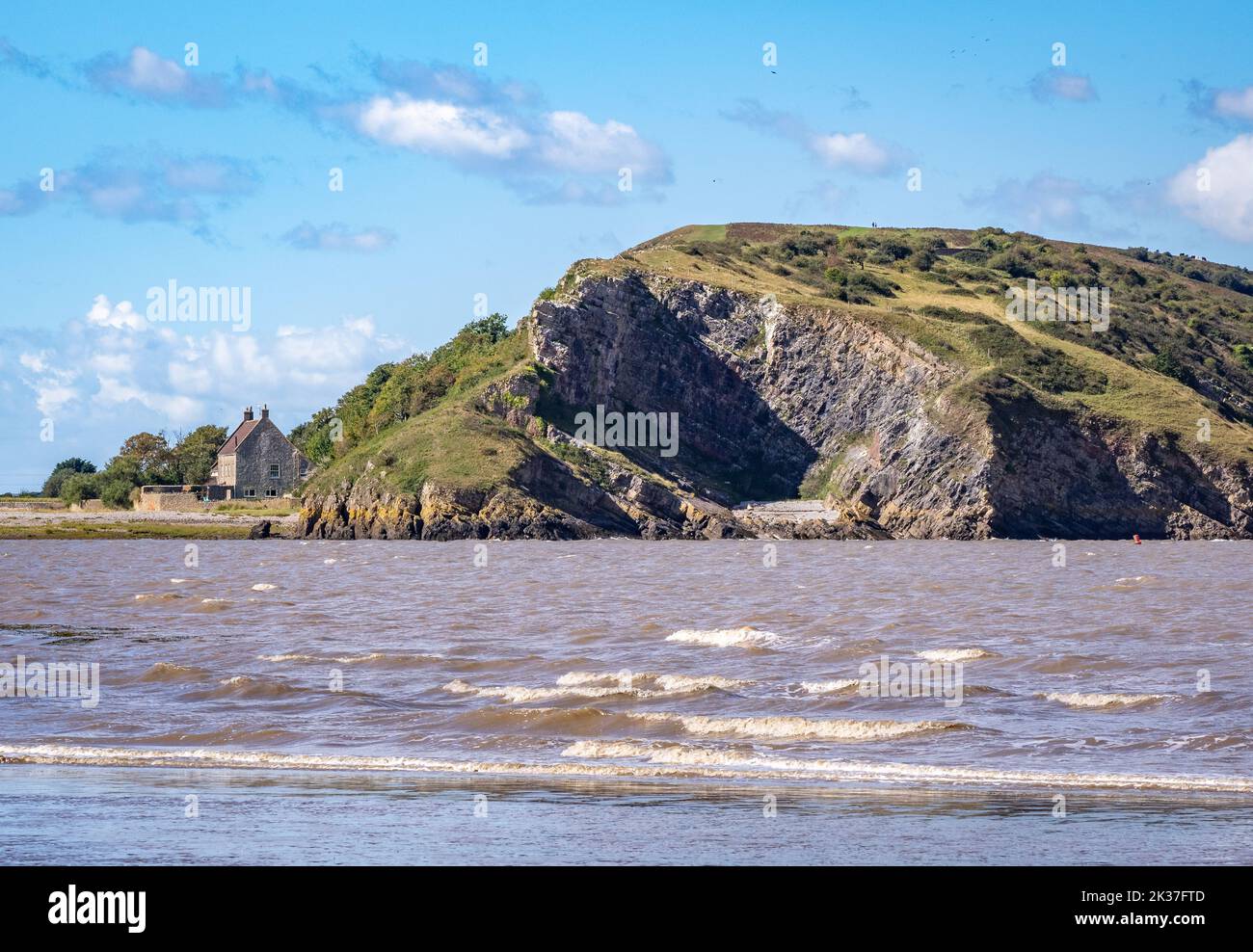 View of Brean Down an outlier of the Mendip Hills from the estuary of the river Axe near Weston super Mare in Somerset UK Stock Photo