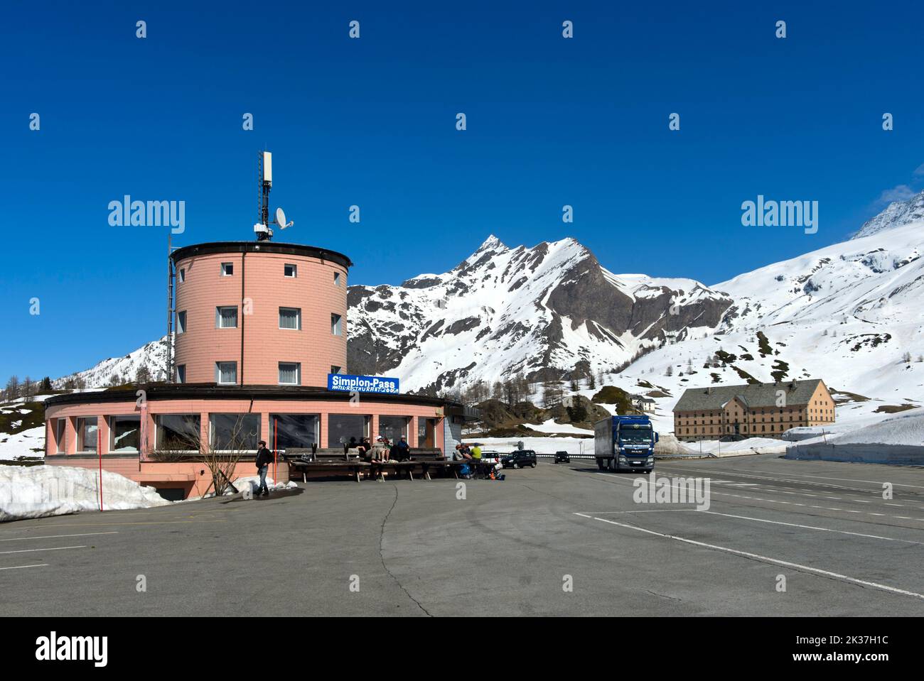 On the Simplon Pass, Hotel Restaurant Monte Leone on the left, the Simplon Hospice behind on the right, Simplon Dorf, Valais, Switzerland Stock Photo