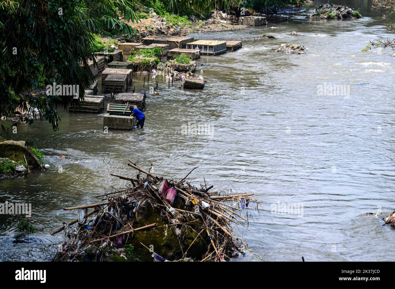 Seen various types of waste such as plastic, baby diapers and shampoo sachets scattered in one of the rivers in the city of Malang. Based on data from the Institute for the Study of Ecology and Wetland Conservation (Ecoton), every year there are 8 million tons of plastic waste in Indonesia, especially on the island of Java. Of this amount, 3 million tons can be processed while 5 tons are not managed. (Photo by Moch Farabi Wardana / Pacific Press) Stock Photo