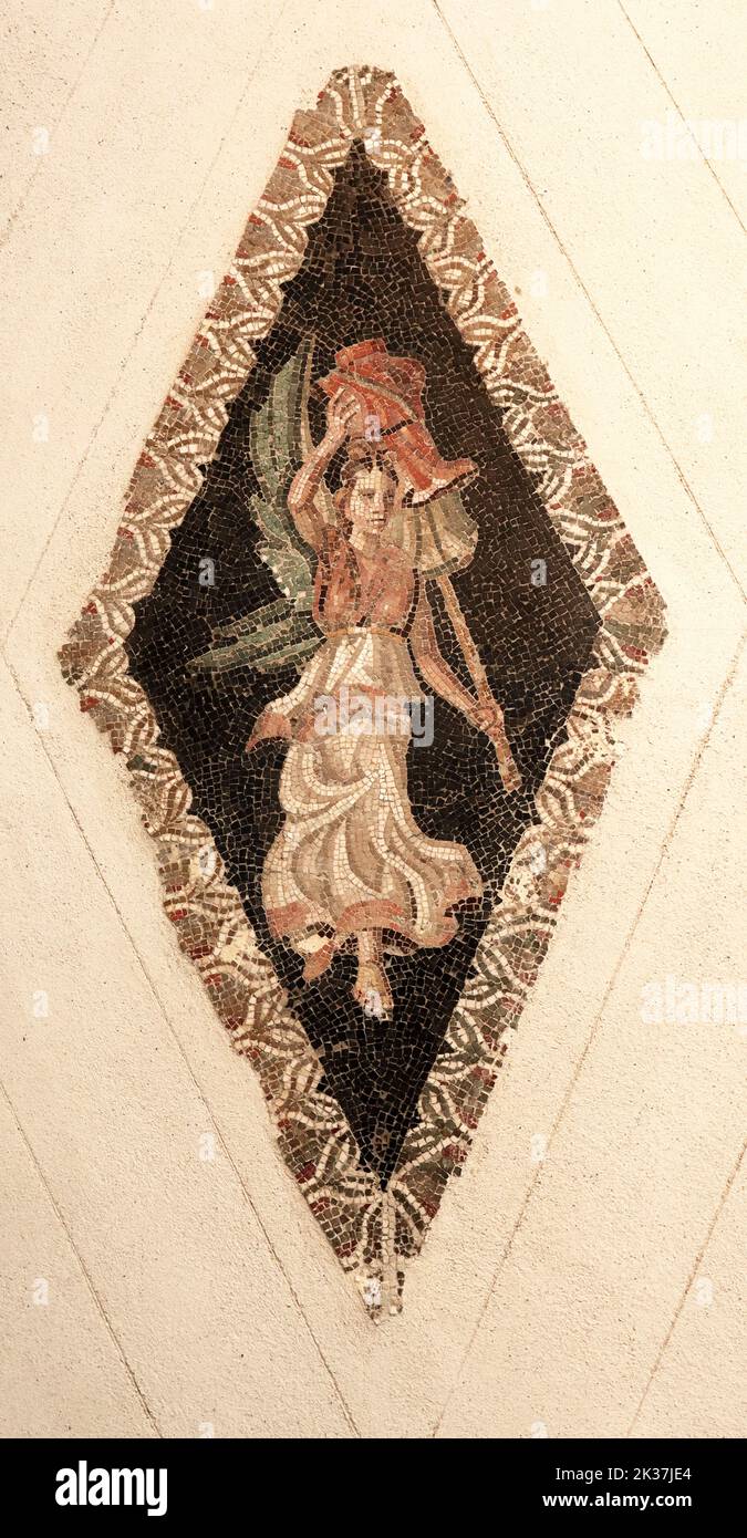 roman mosaic of small polychrome marble pieces with a woman Stock Photo