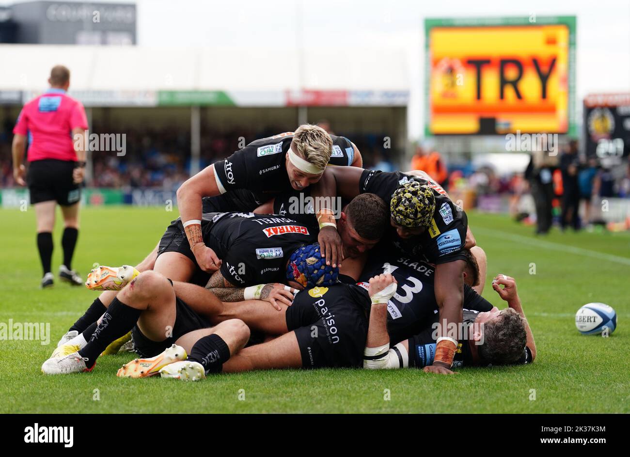 Exeter Chiefs' Harvey Skinner (hidden) is mobbed by team-mates after scoring their side's fourth try during the Gallagher Premiership match at Sandy Park, Exeter. Picture date: Sunday September 25, 2022. Stock Photo