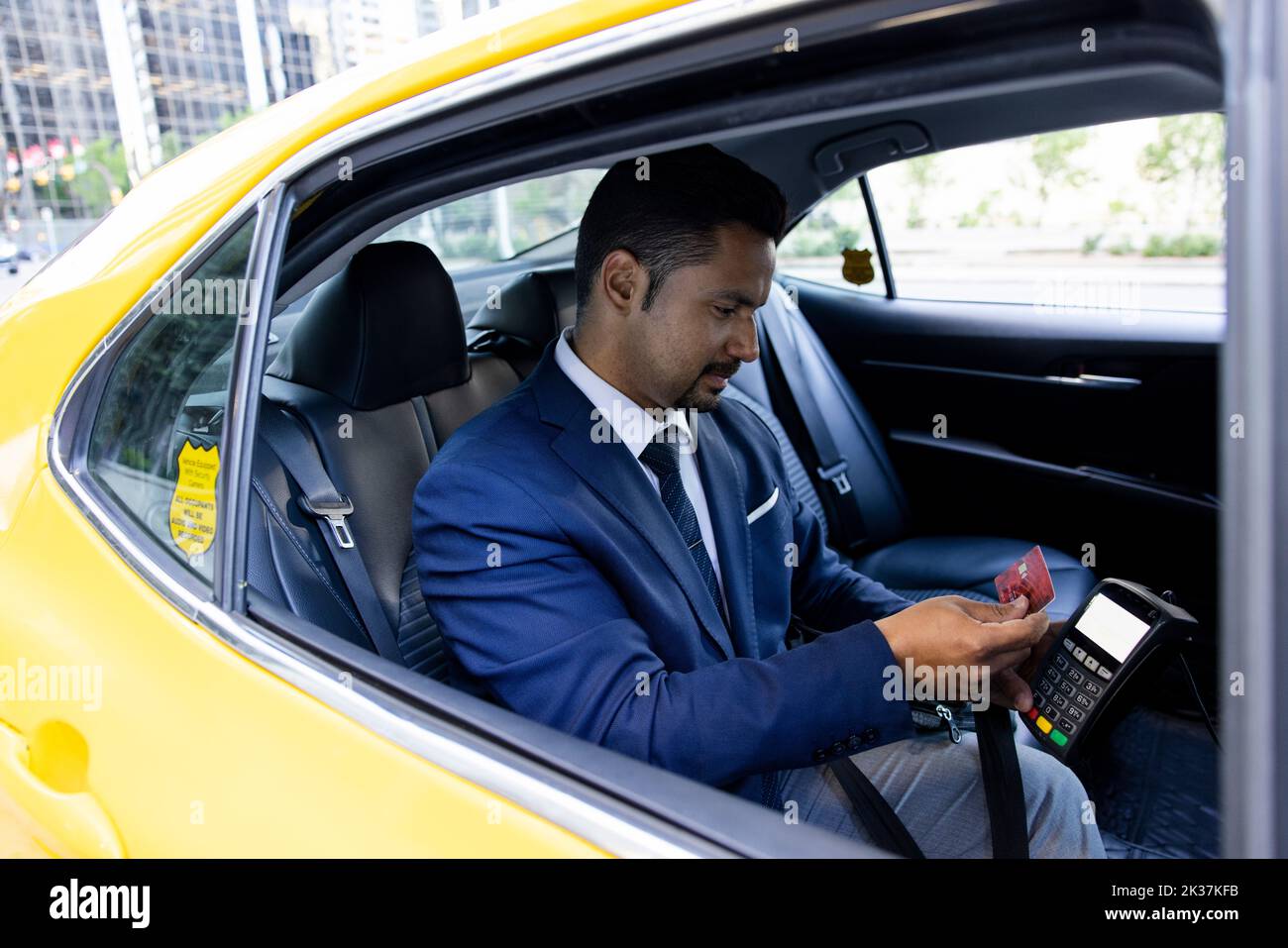 businessman paying for taxi with smart card Stock Photo