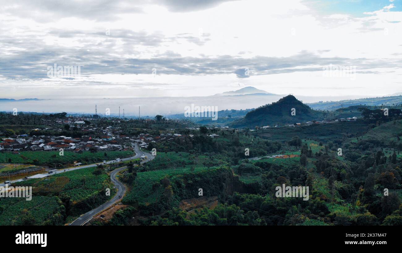 An aerial view a village near the mountains Stock Photo - Alamy