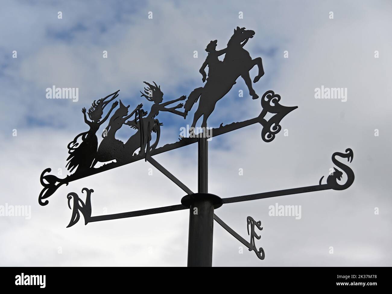 Metal weathervane depicting Robert Burn's 'Tam O'Shanter' with his grey mare Meg, pursued by witches. Poets Path, Robert Burns Birthplace Museum, Allo Stock Photo