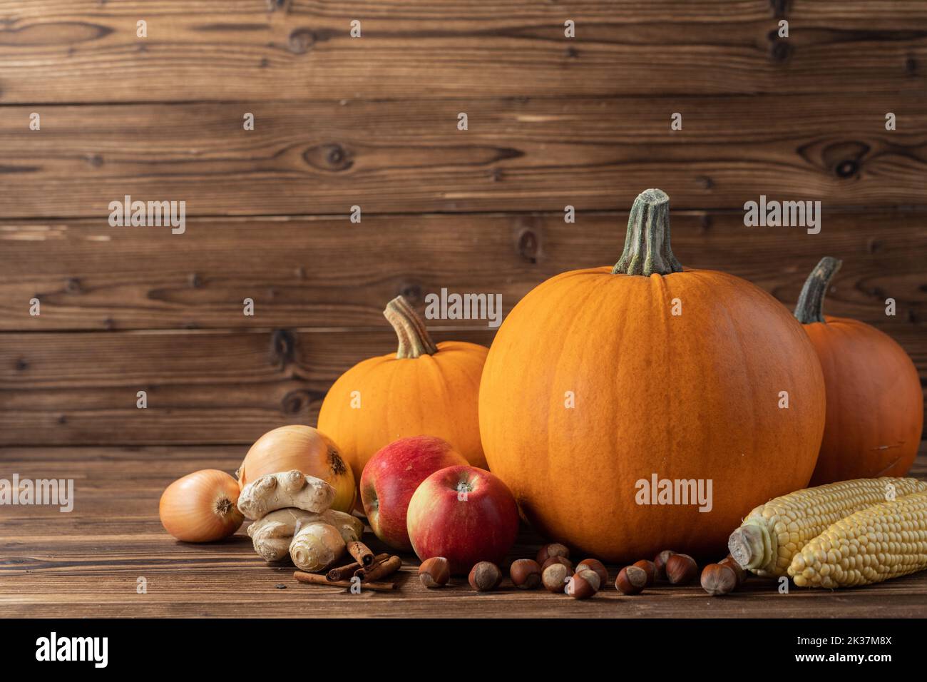 Fall harvest still life with pumpkins in autumn colors on wooden background Stock Photo