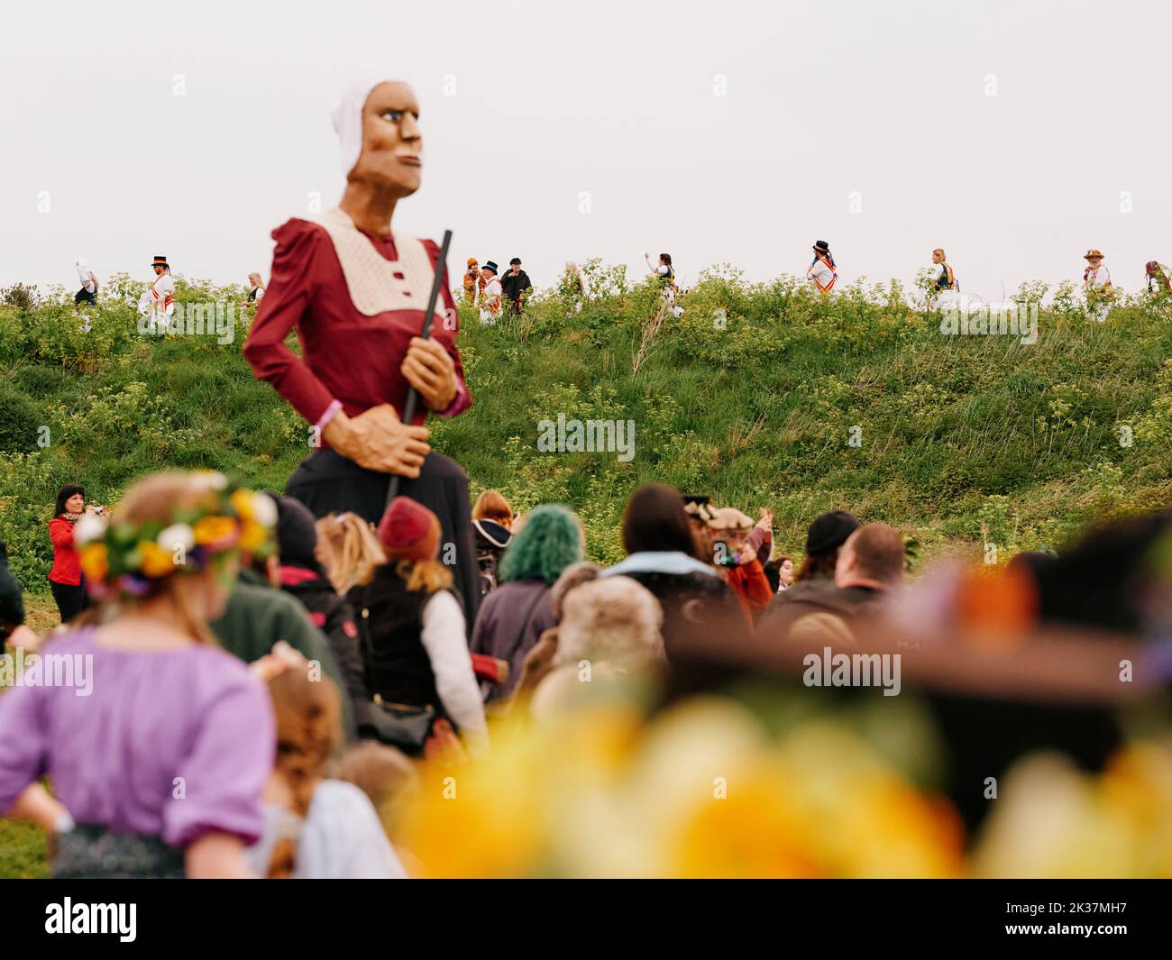 Sunrise folklore gathering with giant on Ladies Parlour green in the Jack in the Green festival May 2022 - West Hill, Hastings East Sussex England UK Stock Photo