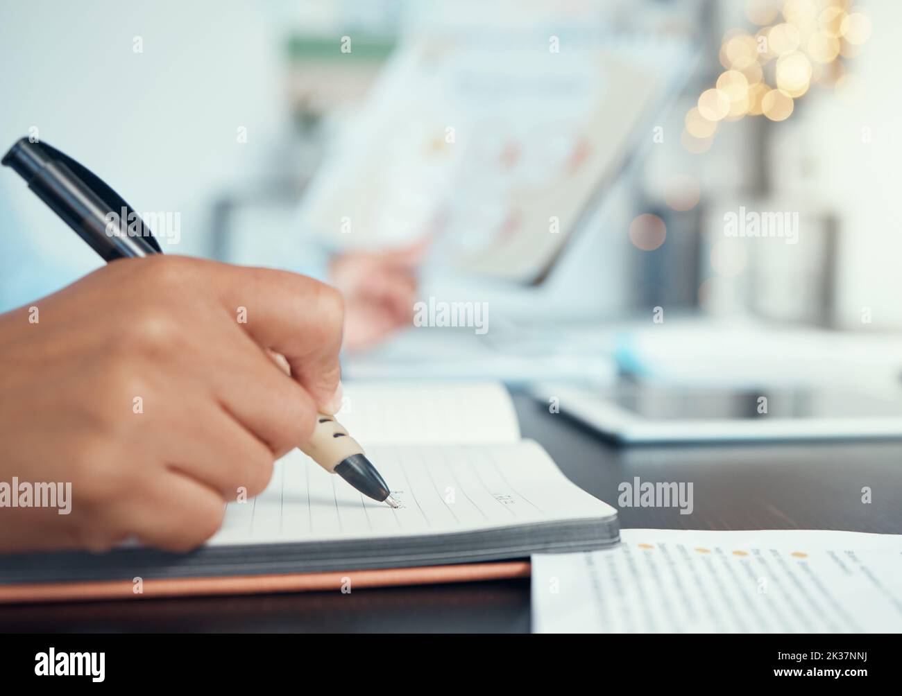 Business woman, hand and notebook writing in marketing planning, target