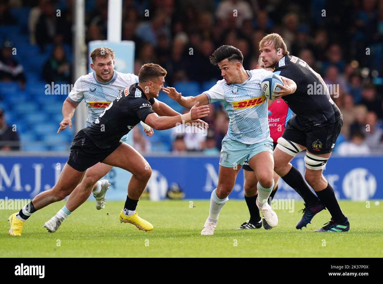 Exeter Chiefs' Henry Slade (left) and Harlequins' Marcus Smith (centre) in action during the Gallagher Premiership match at Sandy Park, Exeter. Picture date: Sunday September 25, 2022. Stock Photo