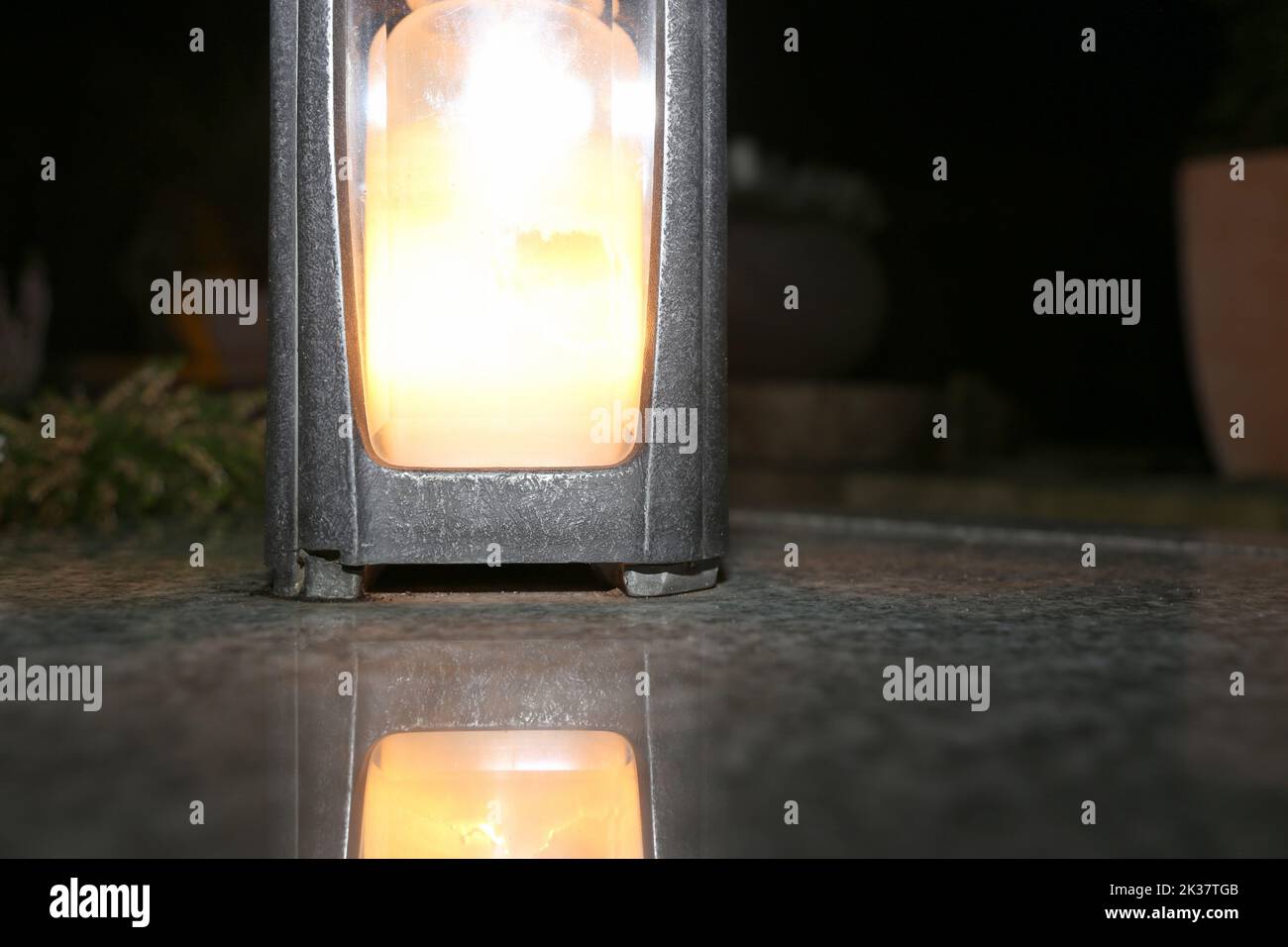 Lighting candles for the dead on All Saints Day Stock Photo Alamy
