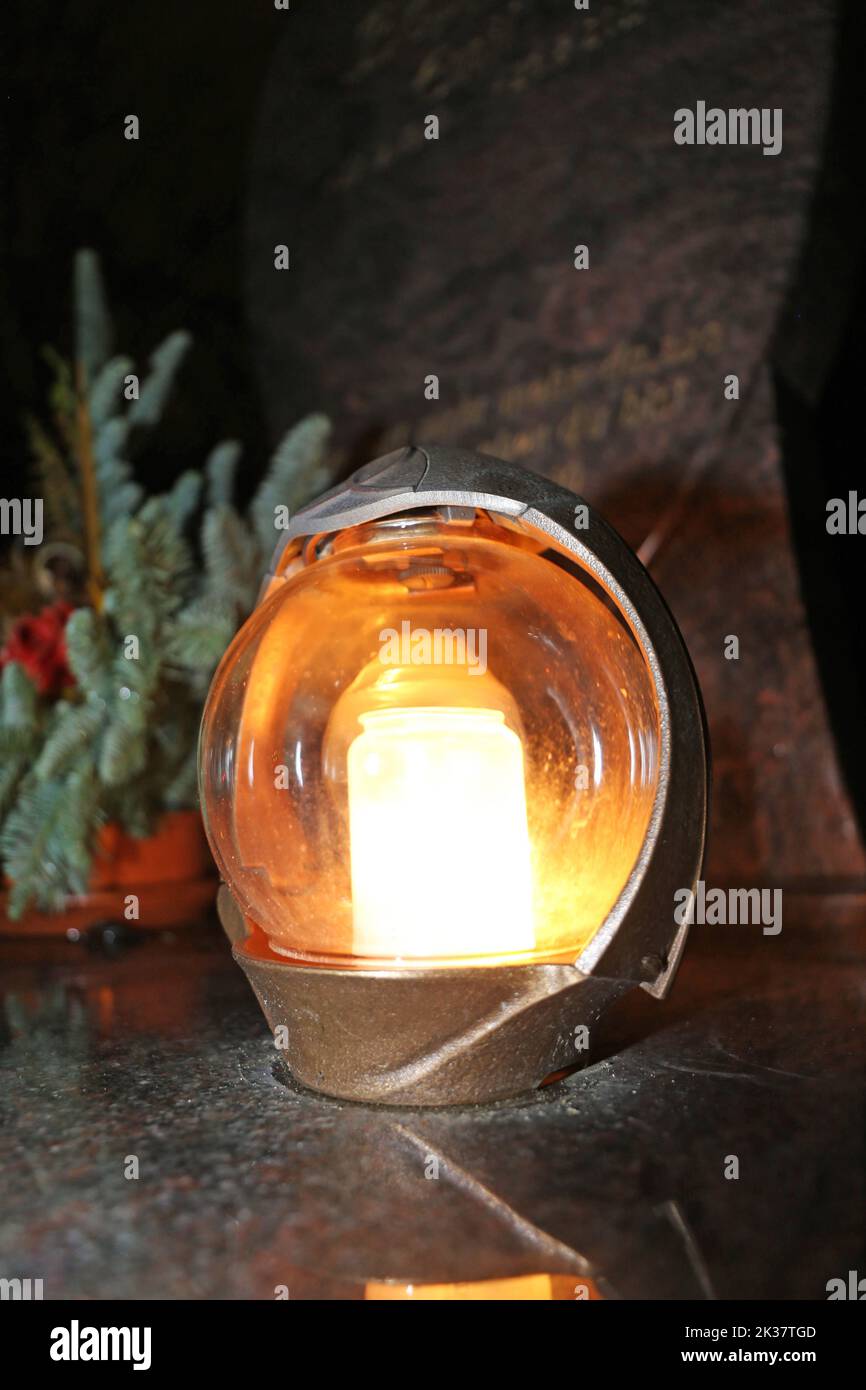 Lighting candles for the dead on All Saints Day Stock Photo Alamy