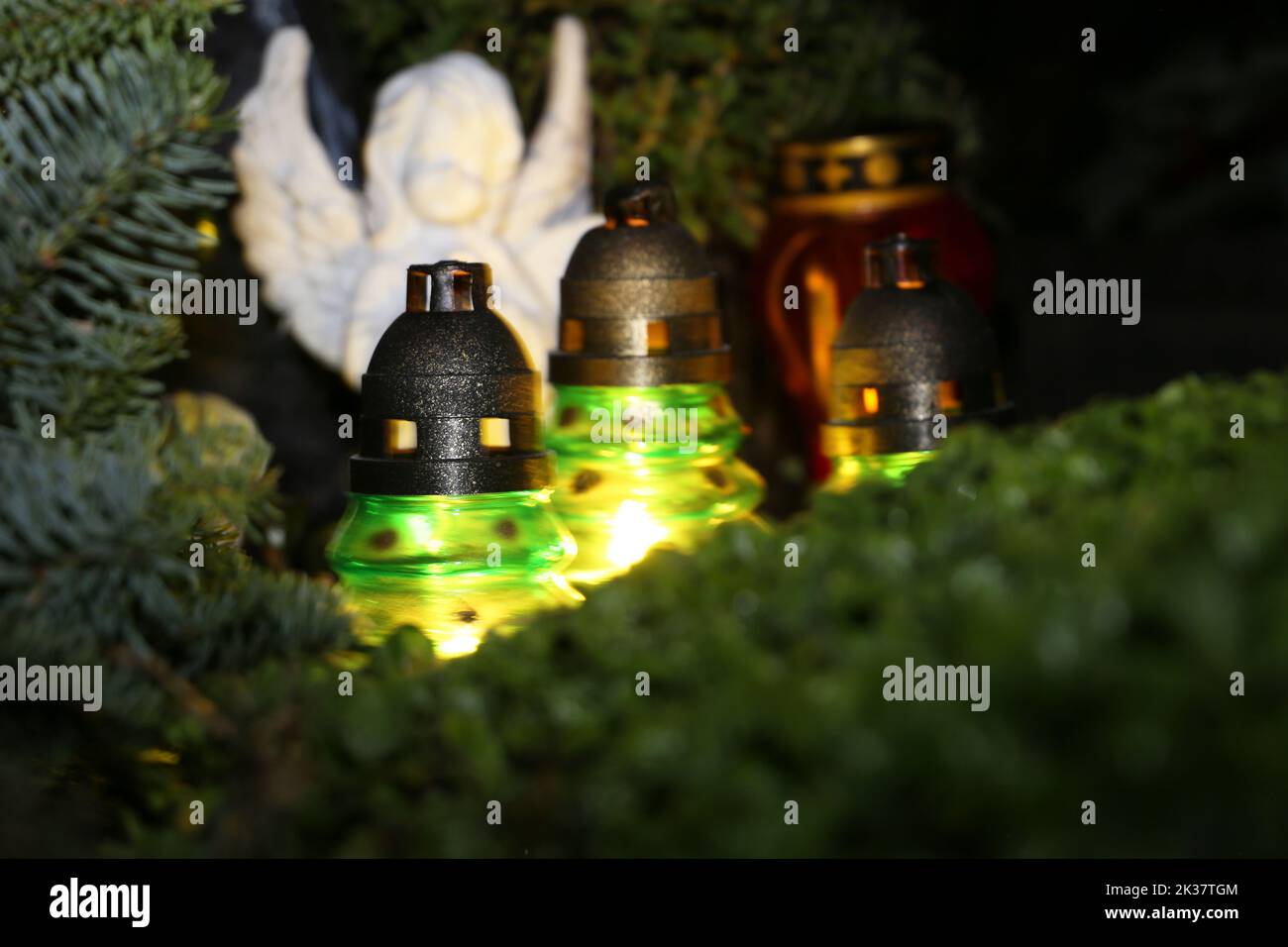 Lighting candles for the dead on All Saints Day Stock Photo Alamy