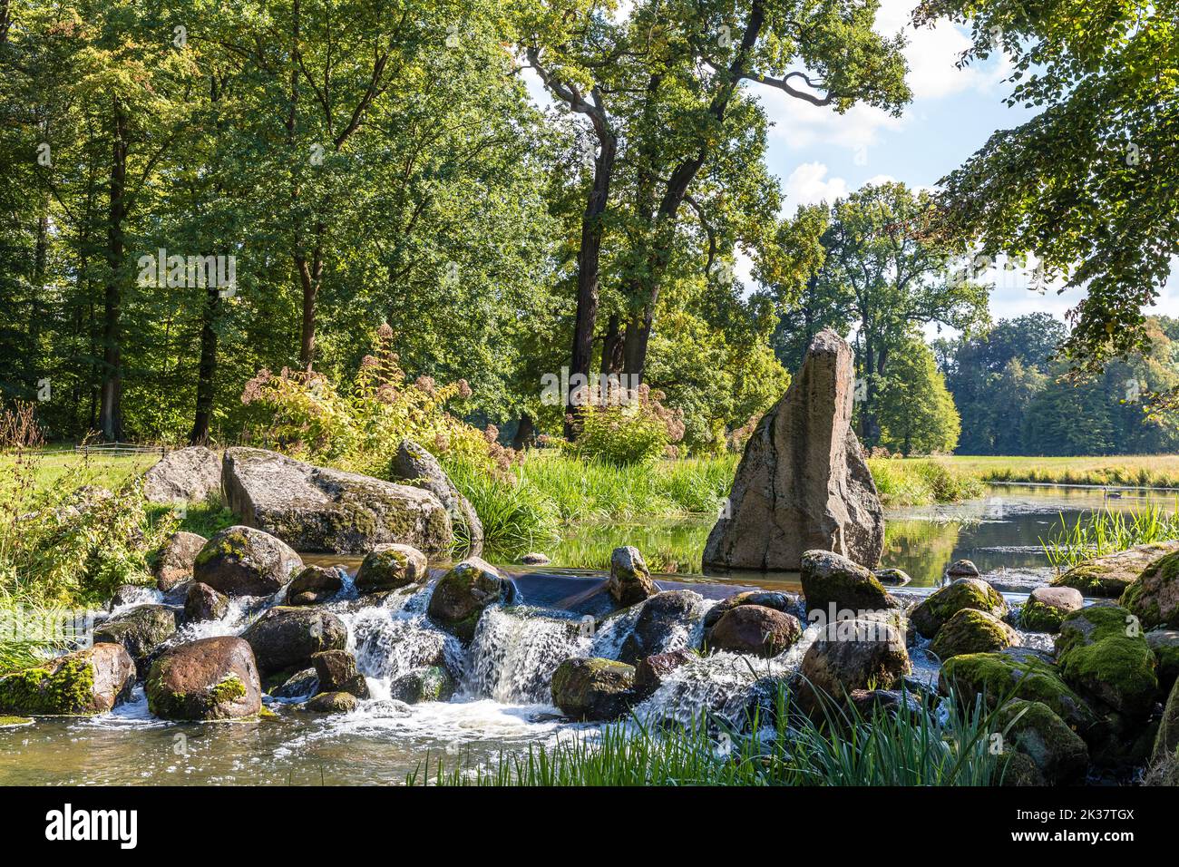 25 September 2022, Saxony, Bad Muskau: Water crosses an artificial ...