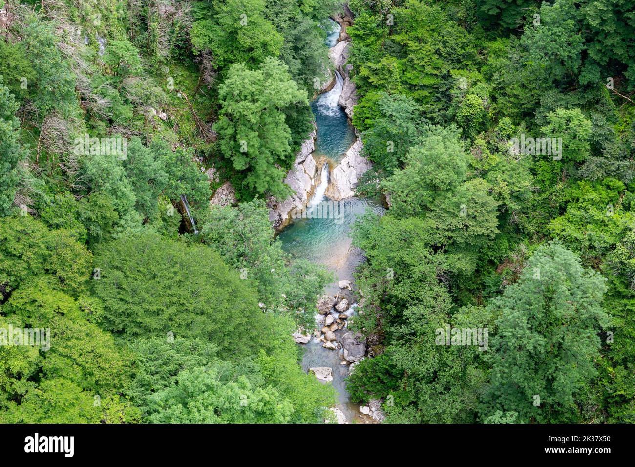 Okatse Canyon with Okatse river in Georgia, lush vibrant green vegetation and forests with river seen from above. Stock Photo