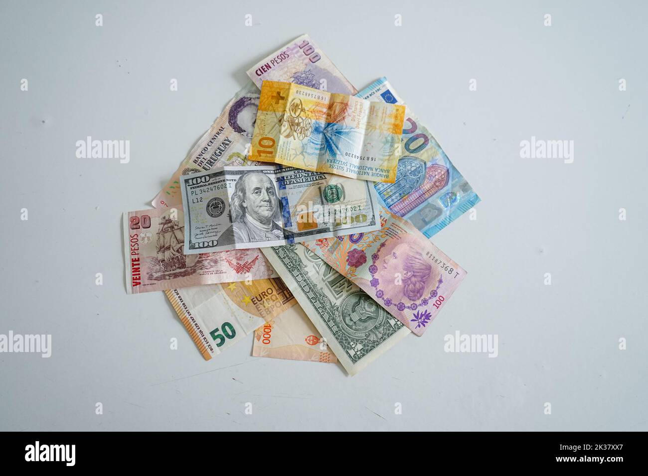 Banknotes from different currencies on white background Stock Photo - Alamy