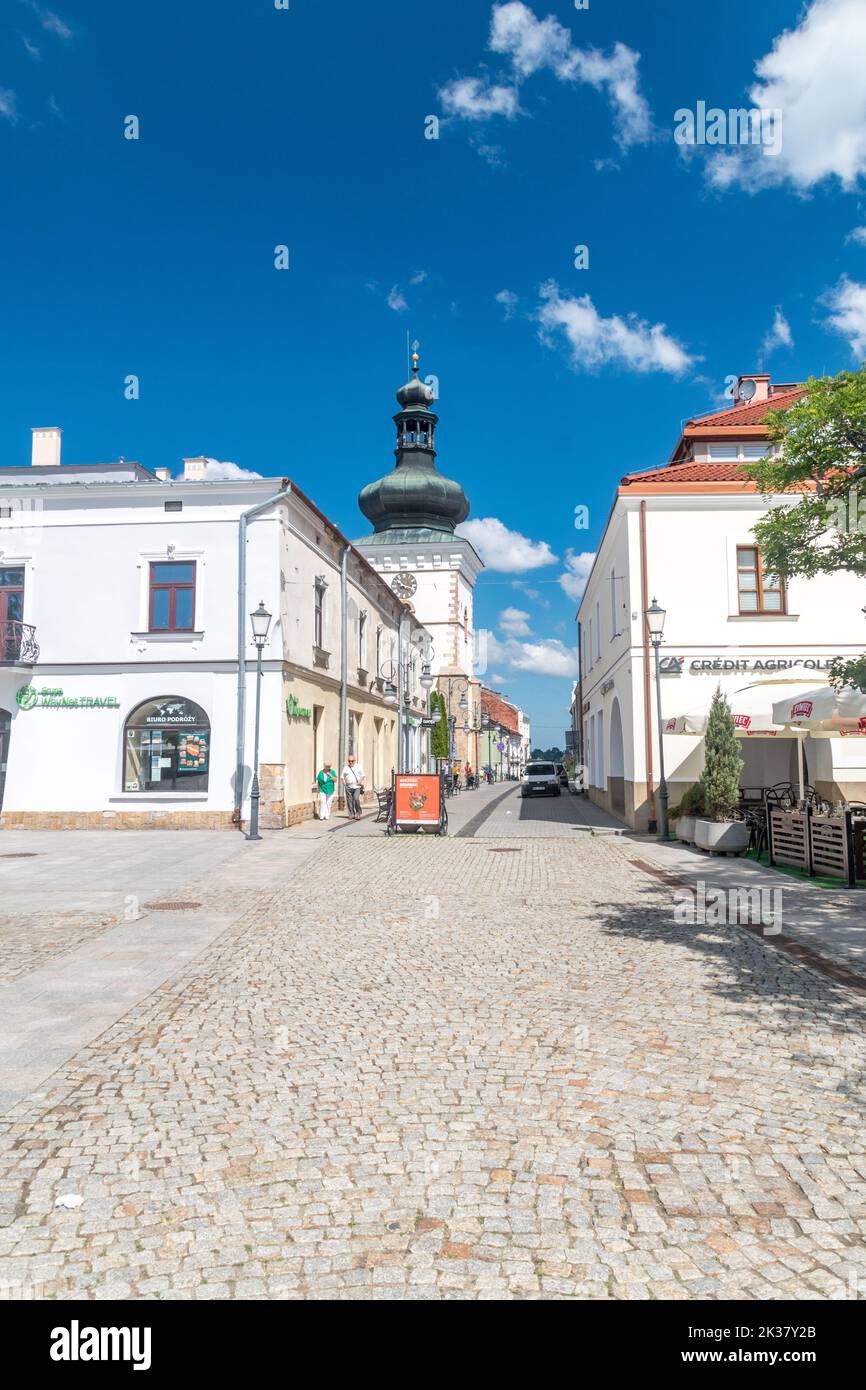Krosno, Poland June 12, 2022 Street with Farna bell tower Stock