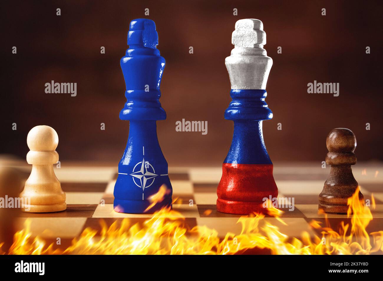 Chess Pieces Surrounded By Fire Symbol Image, Conflict And War Between NATO And Russia PHOTOMONTAGE Stock Photo