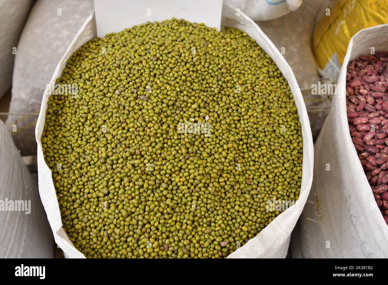 Mung bean Vigna radiata, alternatively known as the green gram or maash sold in Kyrgyzstan in big bag. Central market in Bishkek. Osh open air market Stock Photo