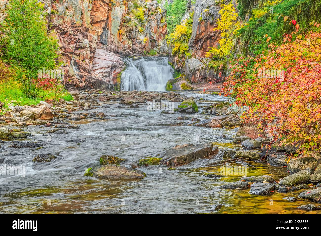 waterfall and fall colors along tenderfoot creek in the little belt mountains near white sulphur springs, montana Stock Photo