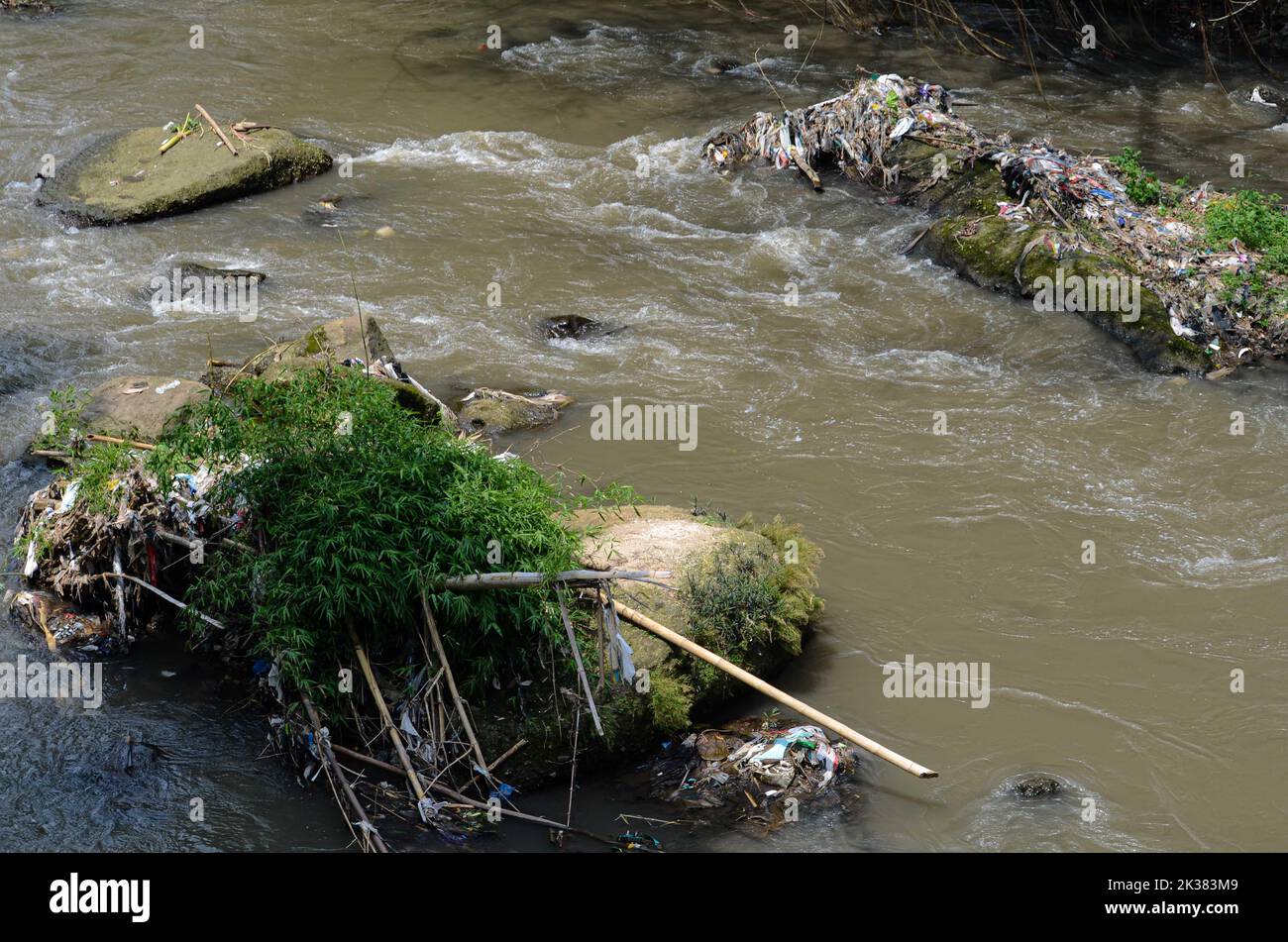 Malang, East Java, Indonesia. 25th Sep, 2022. Seen various types of waste such as plastic, baby diapers and shampoo sachets scattered in one of the rivers in the city of Malang. Based on data from the Institute for the Study of Ecology and Wetland Conservation (Ecoton), every year there are 8 million tons of plastic waste in Indonesia, especially on the island of Java. Of this amount, 3 million tons can be processed while 5 tons are not managed. (Credit Image: © Moch Farabi Wardana/Pacific Press via ZUMA Press Wire) Stock Photo