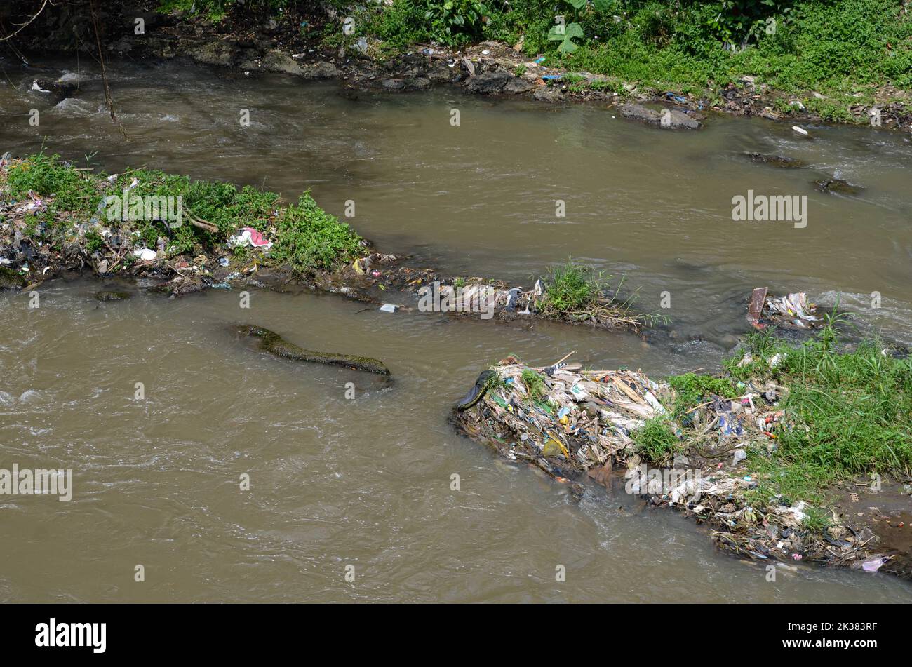 Malang, East Java, Indonesia. 25th Sep, 2022. Seen various types of waste such as plastic, baby diapers and shampoo sachets scattered in one of the rivers in the city of Malang. Based on data from the Institute for the Study of Ecology and Wetland Conservation (Ecoton), every year there are 8 million tons of plastic waste in Indonesia, especially on the island of Java. Of this amount, 3 million tons can be processed while 5 tons are not managed. (Credit Image: © Moch Farabi Wardana/Pacific Press via ZUMA Press Wire) Stock Photo