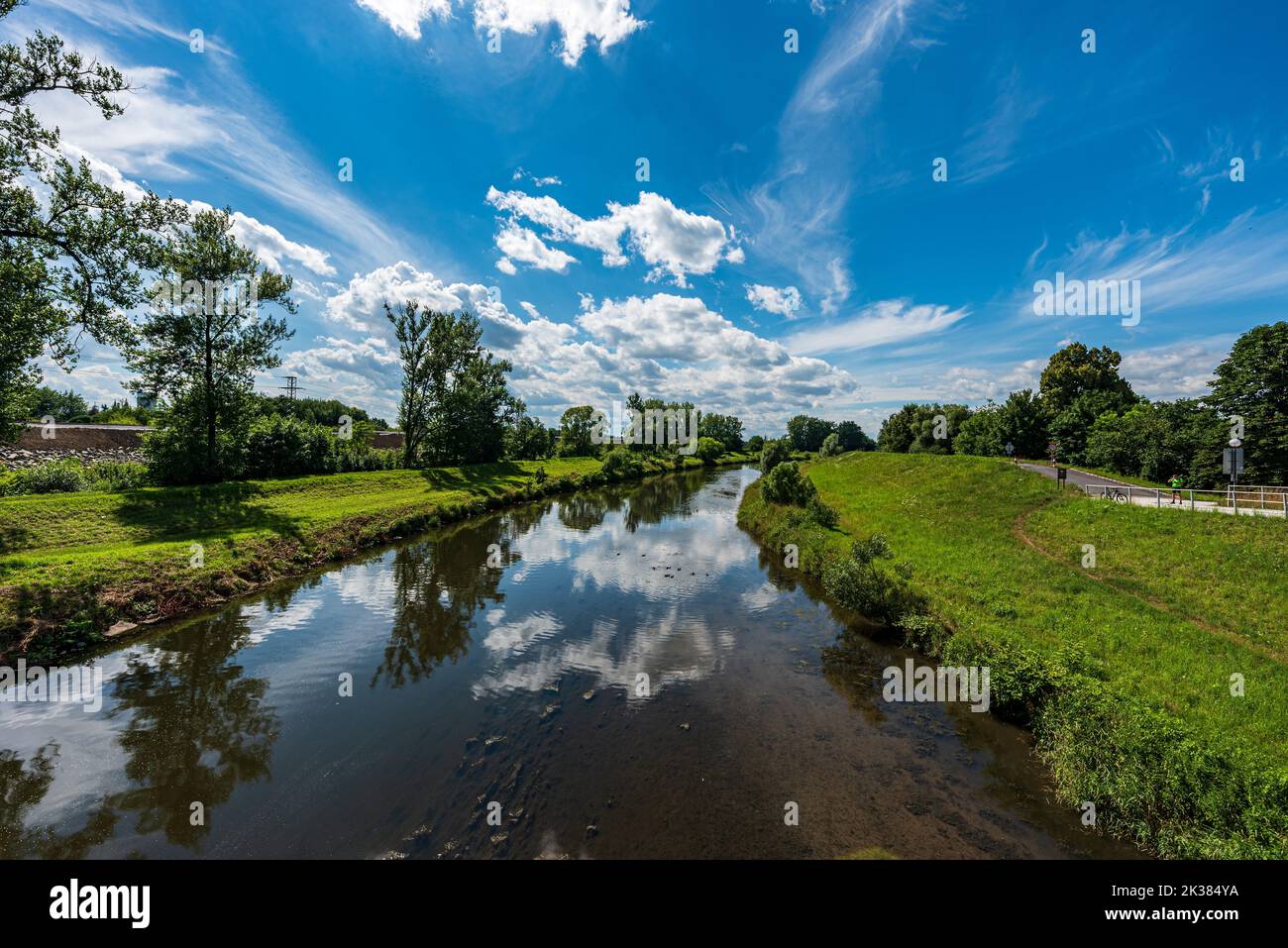 Olse river from Most Sokolovskych hrdinu bridge in Karvina city in Czech republic during beautiful summer day Stock Photo