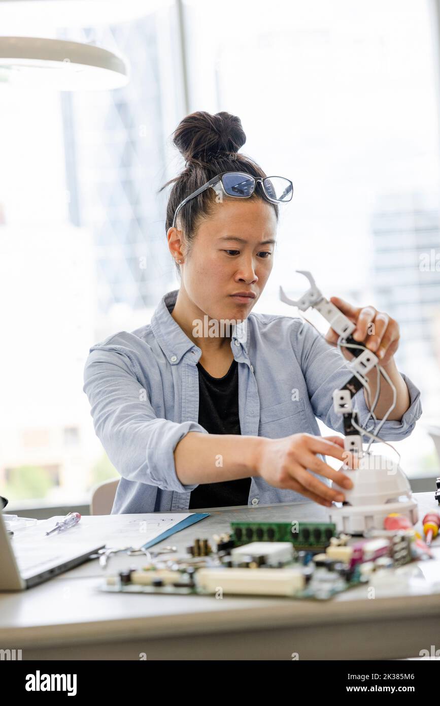 Female engineer assembling robotic arm Stock Photo Alamy