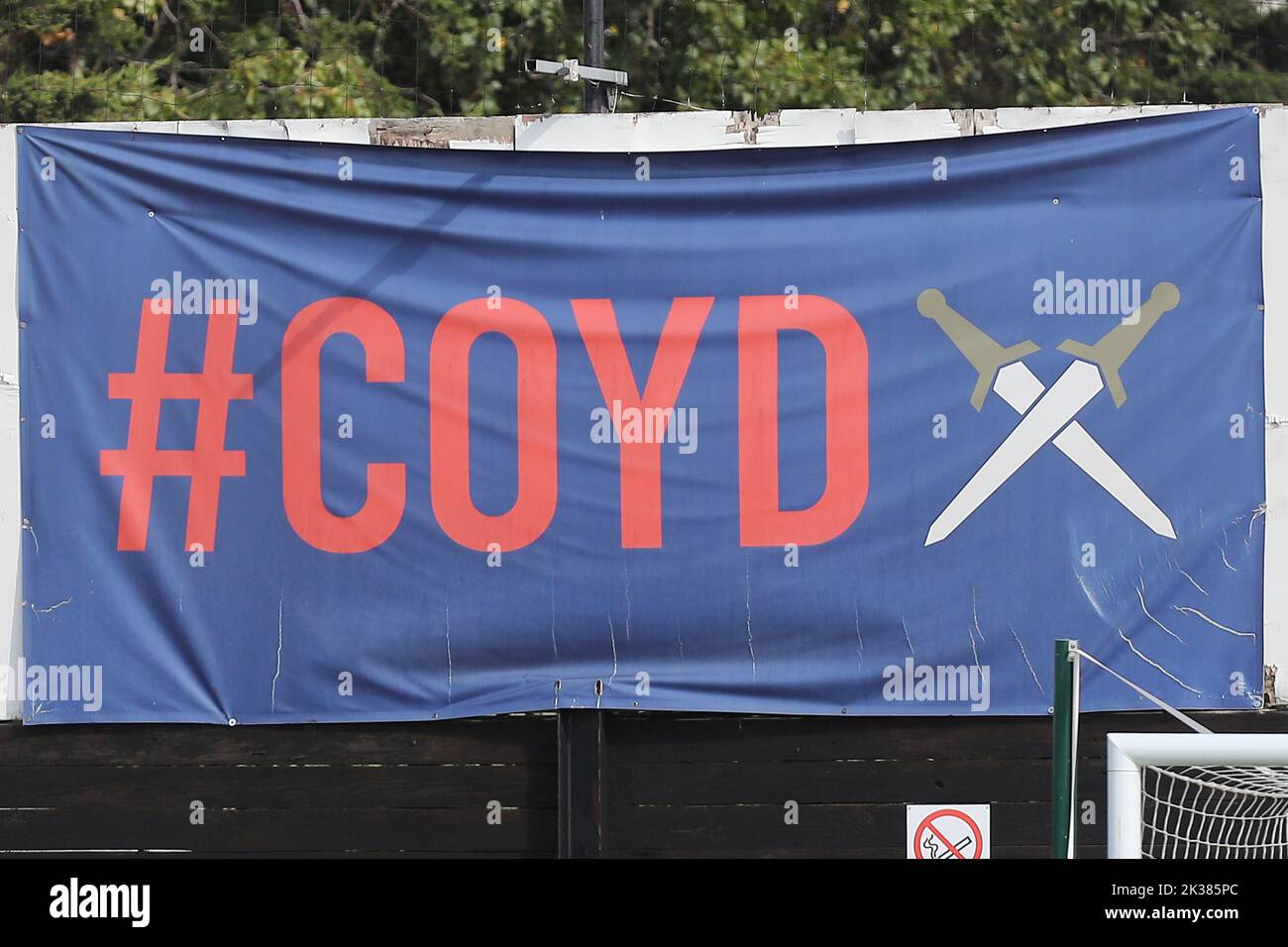 COYD banner during Dagenham & Redbridge vs Barnet, Vanarama National League Football at the Chigwell Construction Stadium on 24th September 2022 Stock Photo