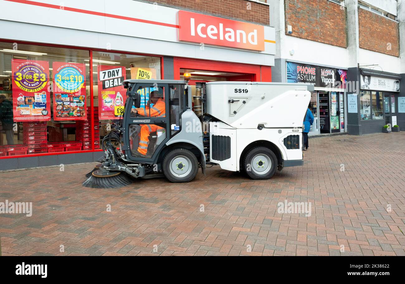a sub-compact single seat Street Sweeping being used on the pedestrian section of Redcar High Street Stock Photo