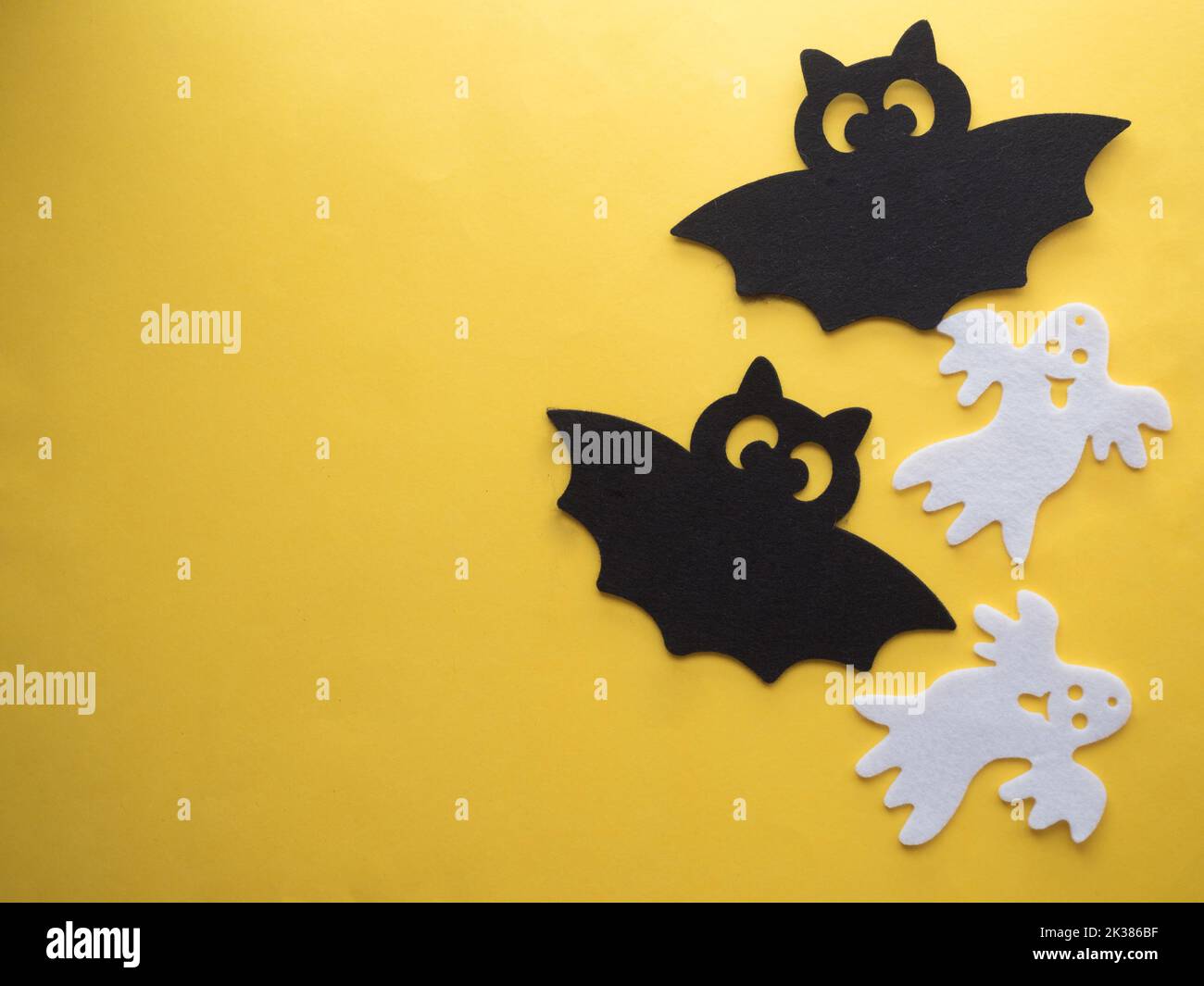 Paper craft ghost and bats in yellow background Stock Photo - Alamy