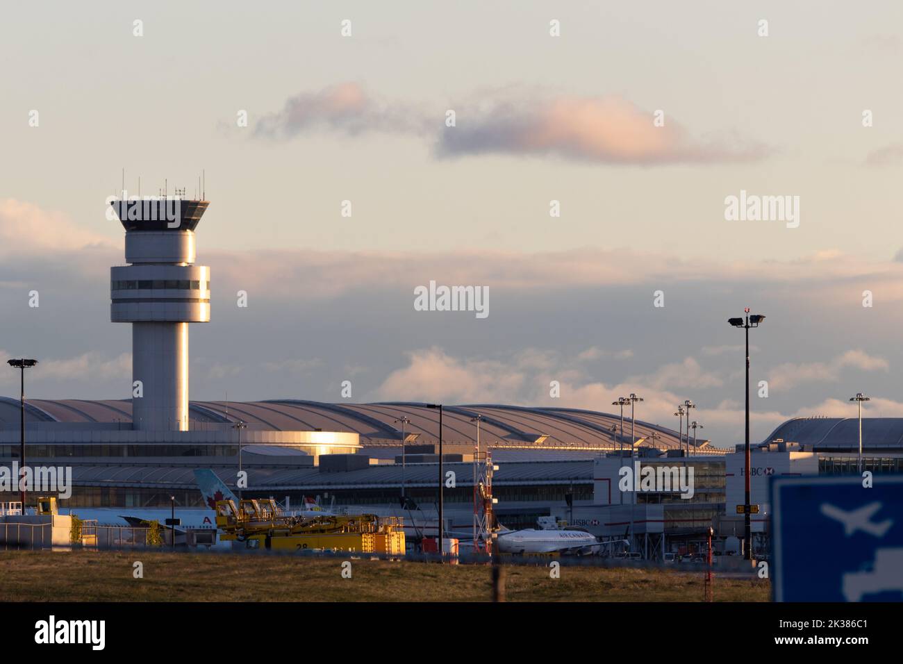 Toronto Pearson Intl. Airport Terminal 1 is seen in the early morning from across the airfield, seen while some Air Canada aircraft are at gates. Stock Photo