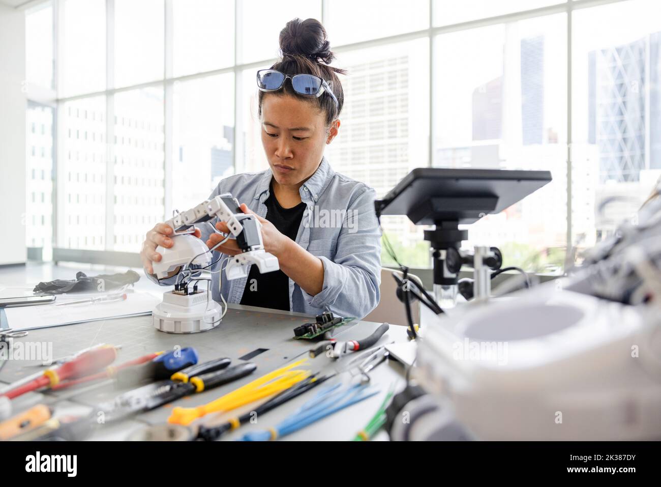 Female engineer assembling robotic arm Stock Photo Alamy