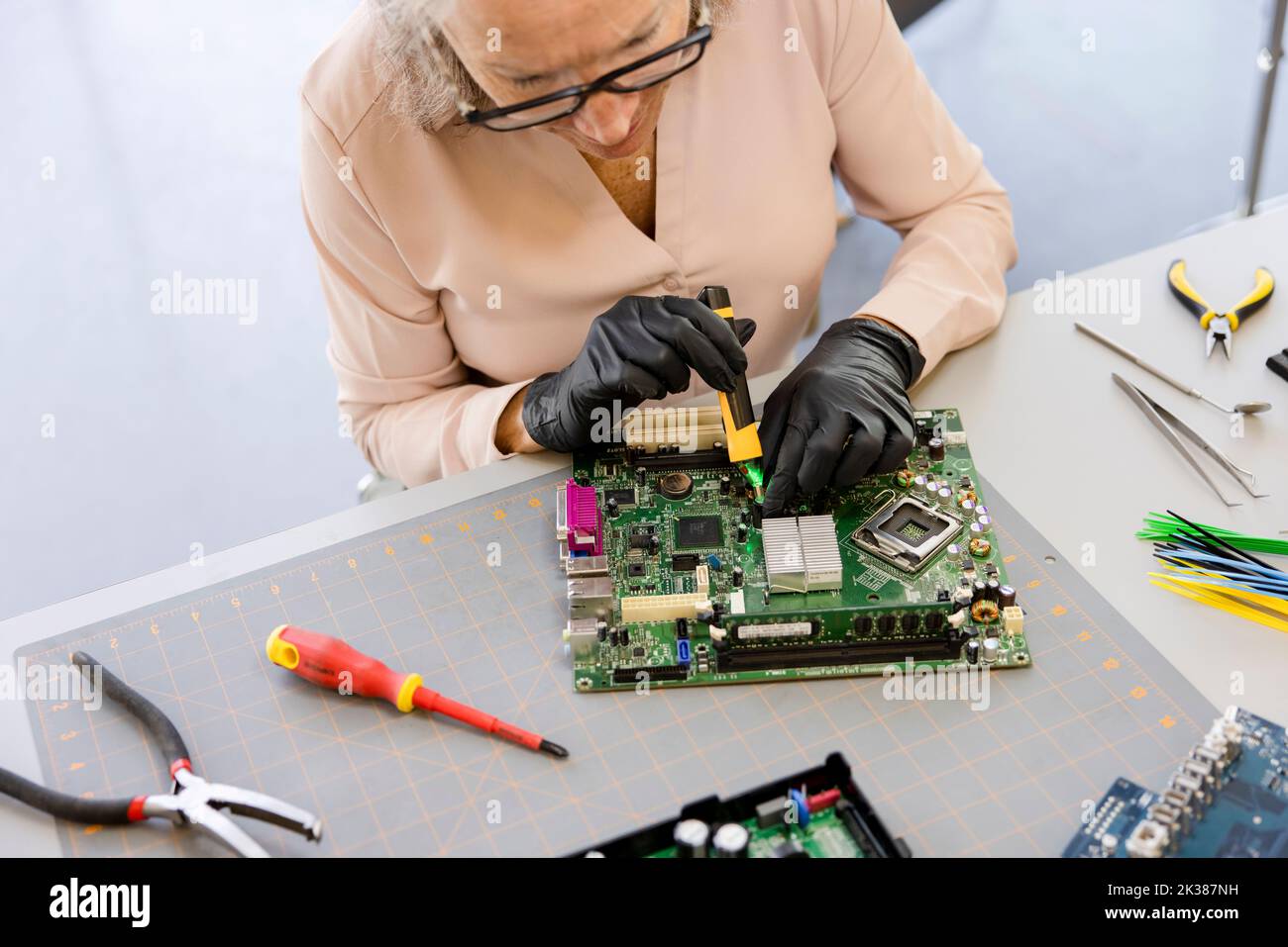Female engineer assembling circuit board Stock Photo Alamy